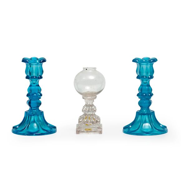 Bonhams Skinner Pair of Blue Pressed Glass Candlesticks and an Oil Lamp, Boston & Sandwich