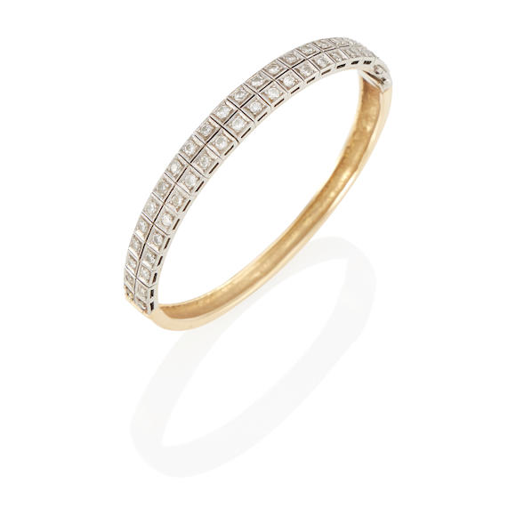 Bonhams : A 14K GOLD, PLATINUM AND DIAMOND BANGLE