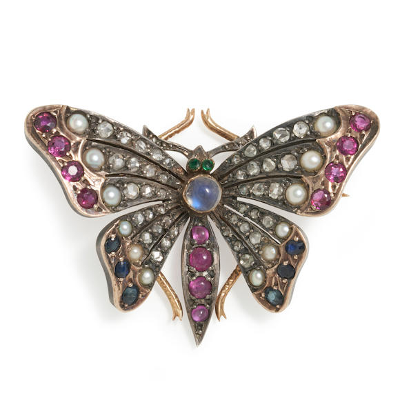 Bonhams Skinner : A GEM-SET BUTTERFLY BROOCH