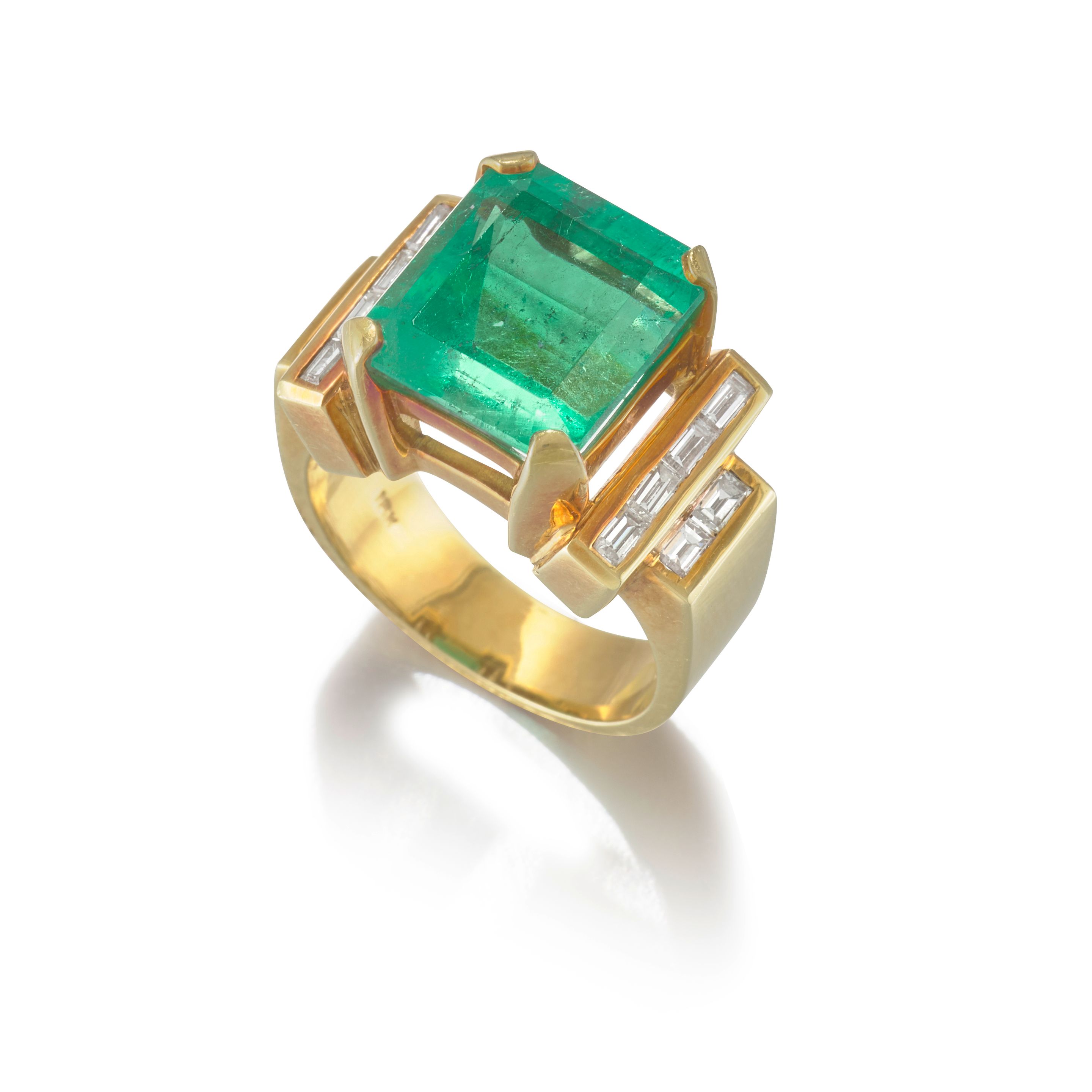 AN EMERALD AND DIAMOND RING