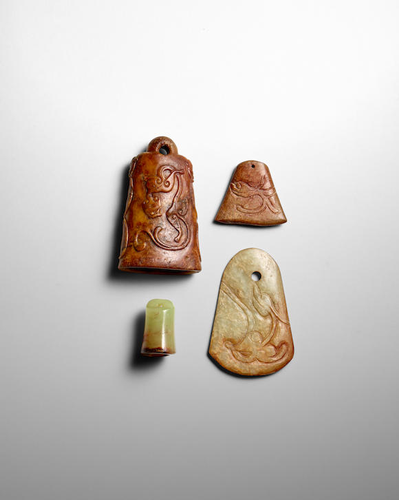 Bonhams : FOUR ARCHAISTIC JADE AND HARDSTONE BELL-SHAPED PENDANTS Late ...