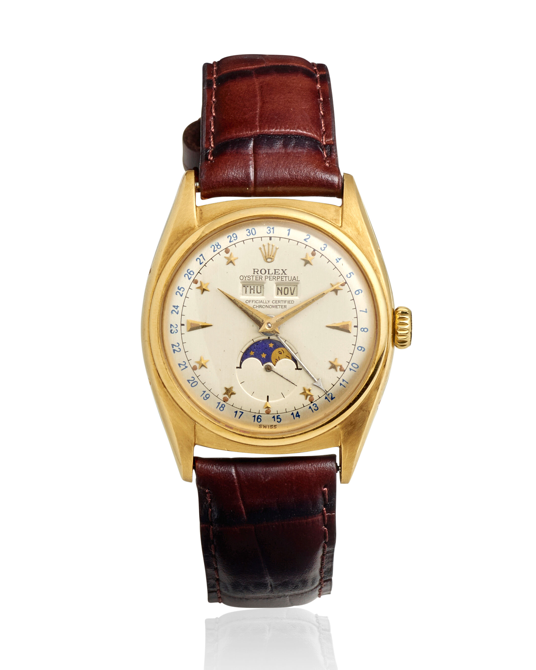 Bonhams : ROLEX. A RARE 18K GOLD AUTOMTIC TRIPLE CALENDAR 