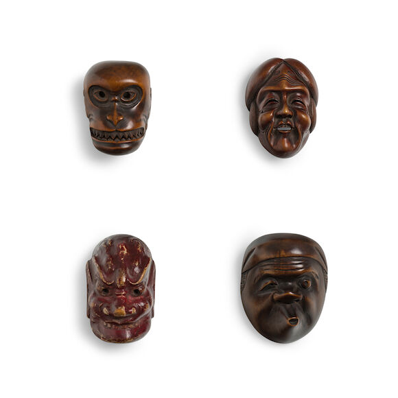 Bonhams : A PAINTED WOOD MASK NETSUKE AND THREE WOOD MASK NETSUKE Edo ...