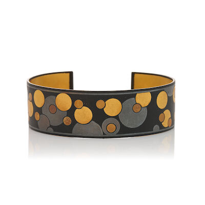 ANGELA CUMMINGS FOR TIFFANY & CO.: A MIXED METAL 'DAMASCENE' CUFF BRACELET, CIRCA 1980