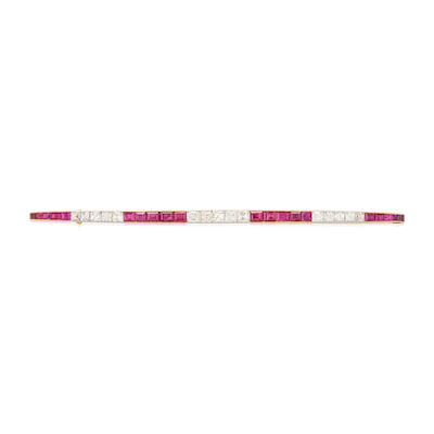 LACLOCHE FRÈRES: A LARGE 18K GOLD, RUBY, AND DIAMOND BAR PIN, FRANCE