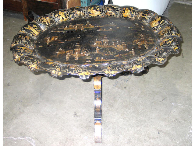 A Victorian Japanned papier-mache tray on stand