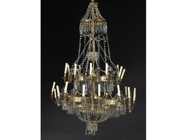 A gilt metal and cut glass monumental three tier chandelier
