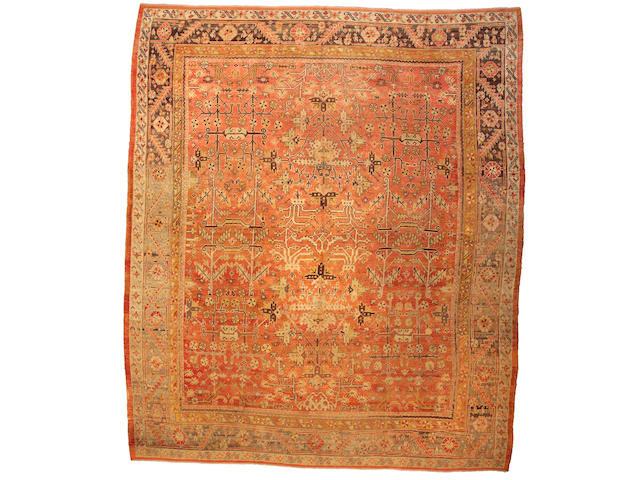 An Oushak carpet West Anatolia, Size approximately 13ft 5in x 15ft 9in