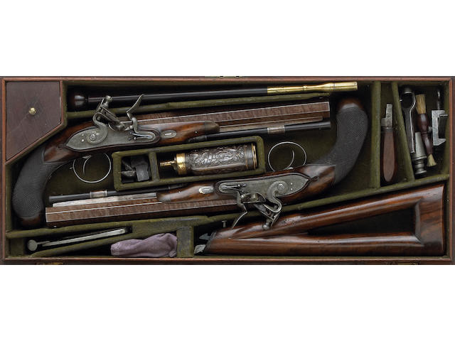A cased pair of English flintlock pistols by William Clark