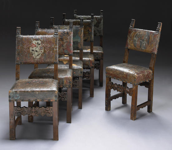 A set of eight Spanish Baroque painted leather and walnut dining chairs Late 17th/early 18th century