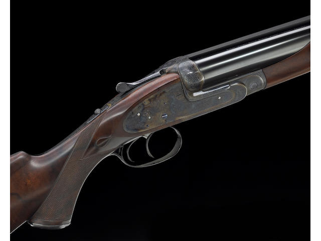 **A rare cased .577 Nitro sidelock ejector double rifle by James Purdey & Son engraved by Ken Hunt.