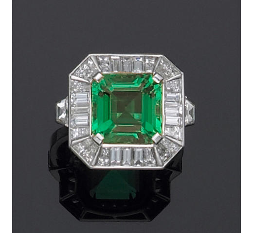 A natural emerald, diamond and platinum ring