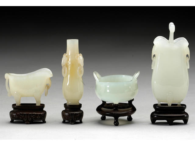 Four miniature white jade vessels