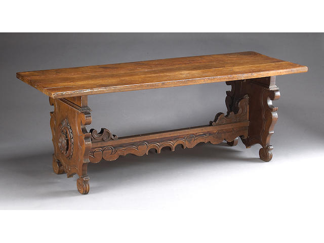A Baroque style walnut refectory table