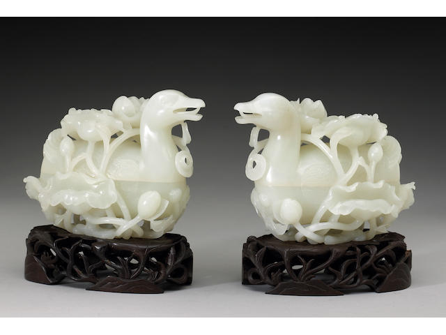A pair of white jade duck form boxes