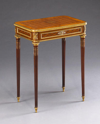 A Louis XVI style  gilt bronze mounted parquetry table &#224; &#233;crire
