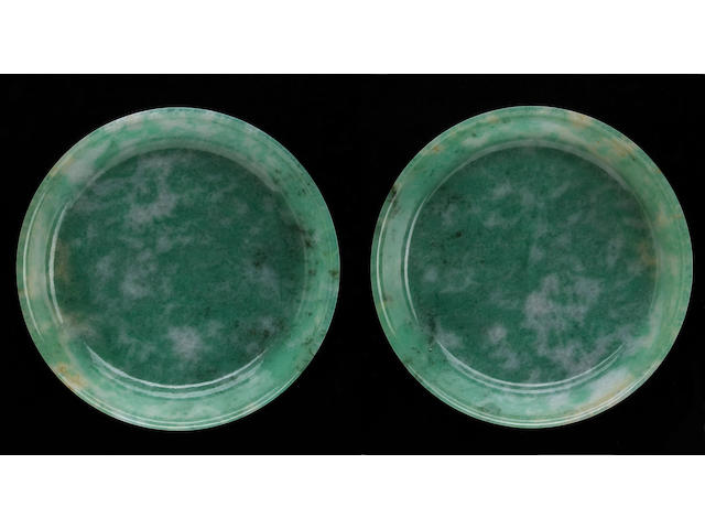 A pair of fine mottled green jadeite deep dishes