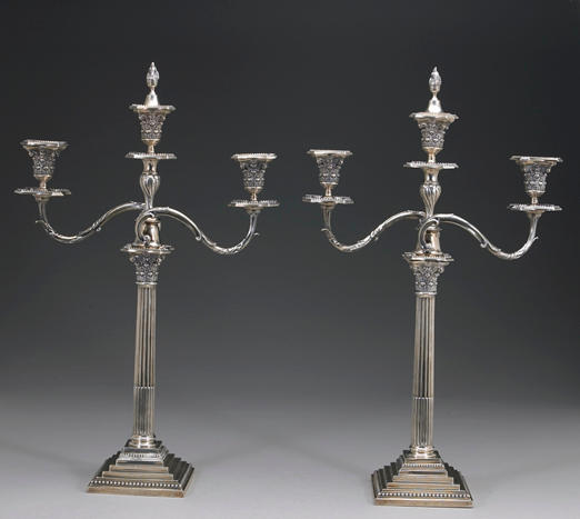 A Victorian silver pair of Corinthian columnar candlesticks