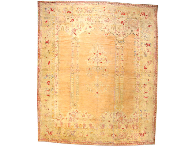 An Oushak carpet West Anatolia, Size approximately 13ft 2in x 15ft 9in