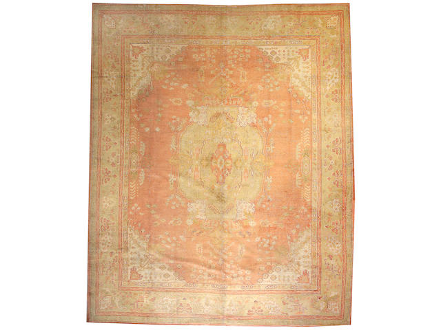 An Oushak carpet West Anatolia, Size approximately 13ft 2in x 16ft 2in