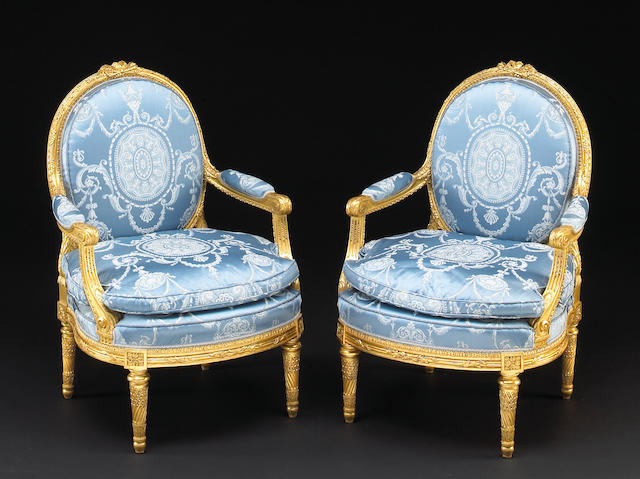 &#224;A pair of Louis XVI style giltwood fauteuils &#224; la reine