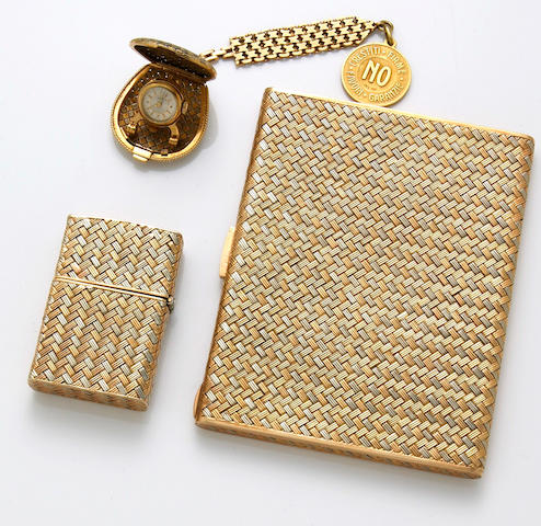 A set of eighteen karat white and yellow gold accessories