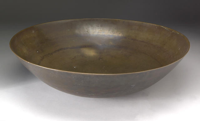 A patinated bronze opium bowl
