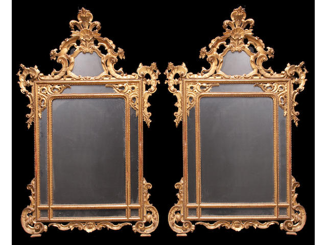 A pair of Italian Rococo style giltwood mirrors