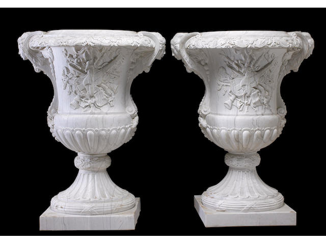 A monumental pair of Neoclassical style marble urns