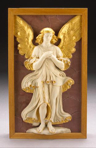 A carved white marble and parcel gilt relief panel of an angel with arms crossed in prayer on a faux rosso antico ground