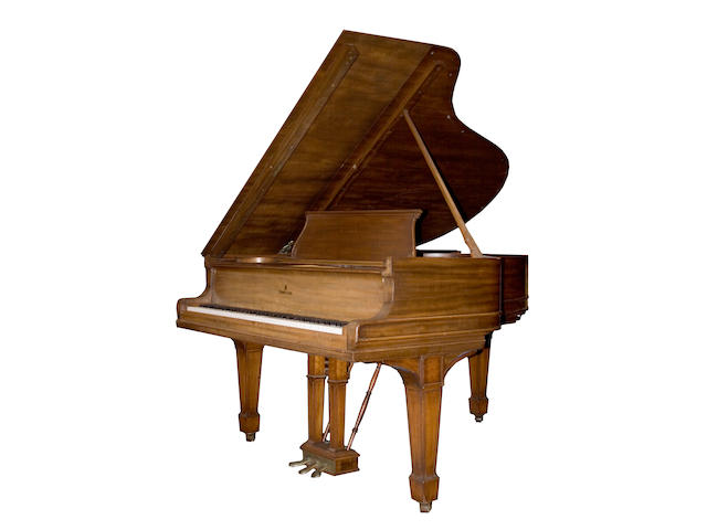 A Steinway walnut grand piano
