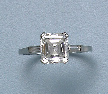 A diamond and platinum solitaire ring
