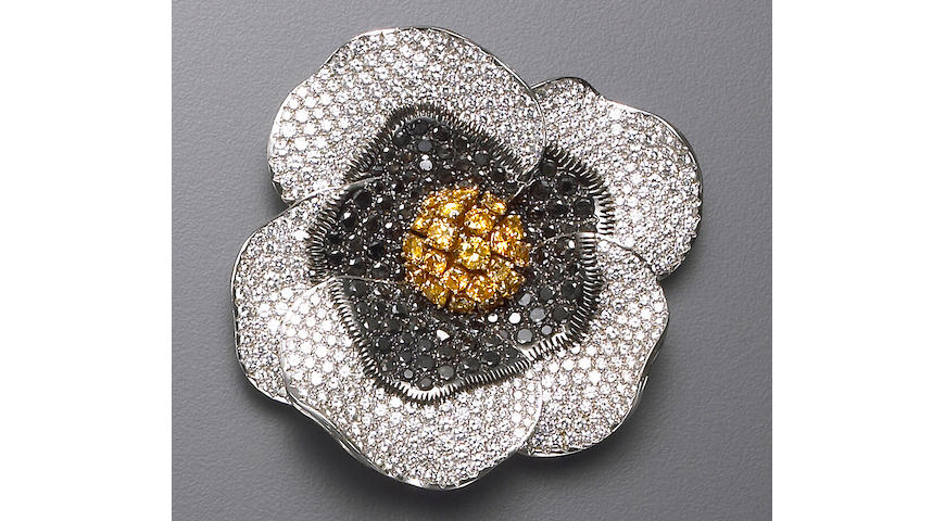A black diamond, diamond, and eighteen karat white gold floral brooch, deGrisogono