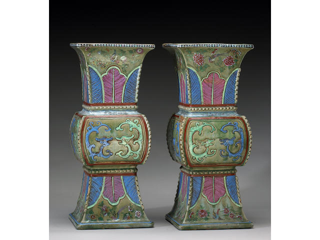 A pair of famille rose enameled pottery vases