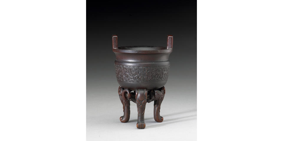 A fine and rare rhinoceros horn libation vessel of ding shape 17th/18th Century