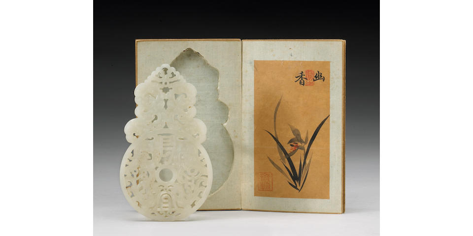 A fine and rare white jade pendant and imperial storage box Qianlong Mark and Period