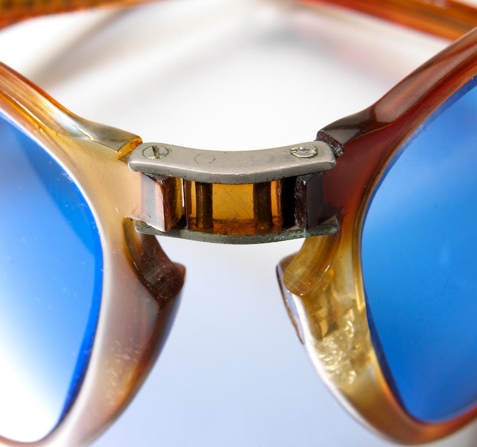 A pair of Persol sunglasses