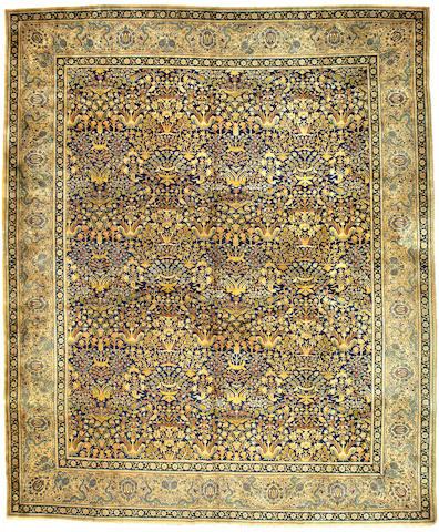 An Indian carpet size approximately 15ft 9in x 13ft