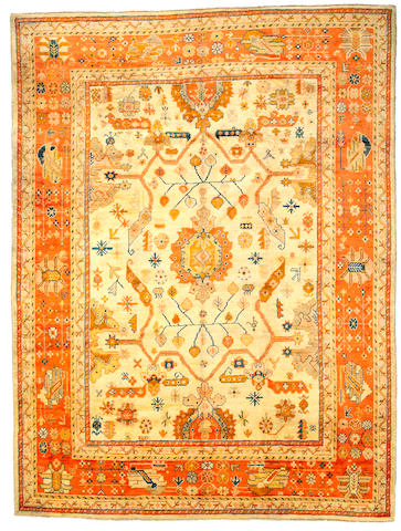 An Oushak carpet West Anatolia size approximately 8ft 4in x 11ft 2in