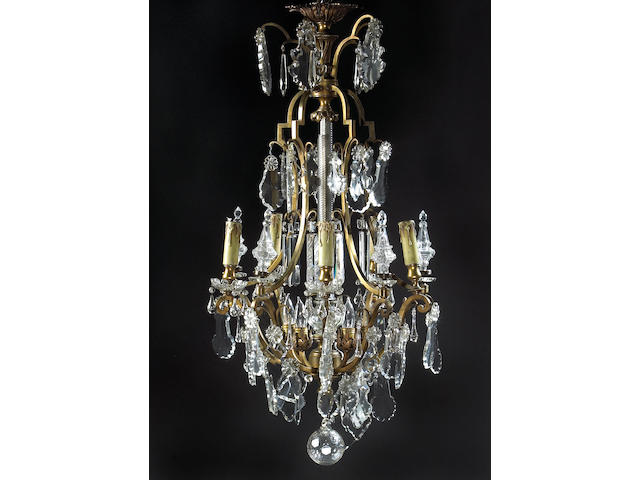 A Louis XV style gilt metal and cut glass ten light chandelier
