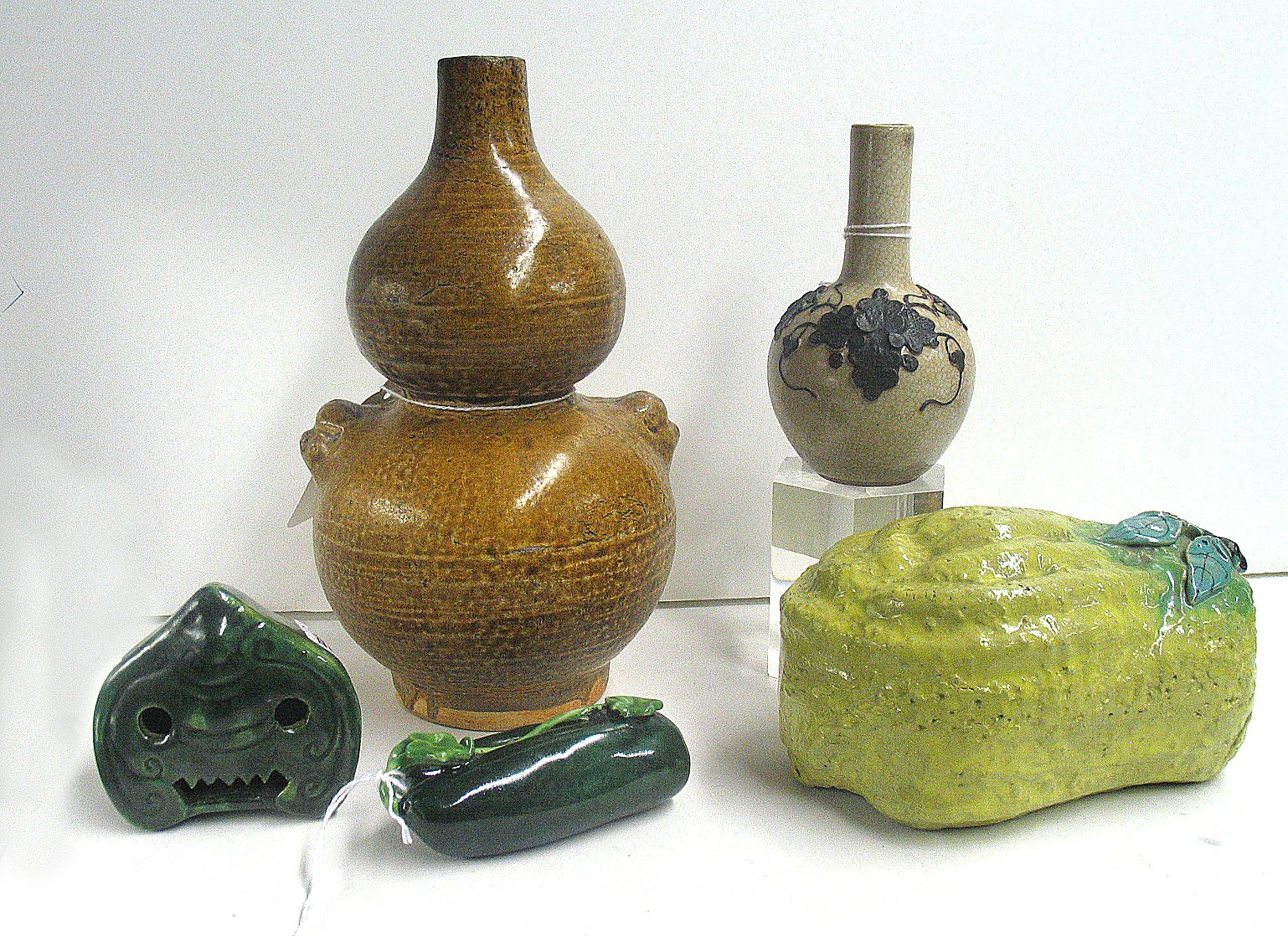 Five molded ceramic decorations