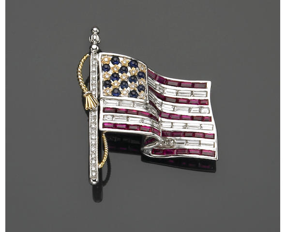 A diamond, ruby, sapphire and eighteen karat white gold American flag brooch