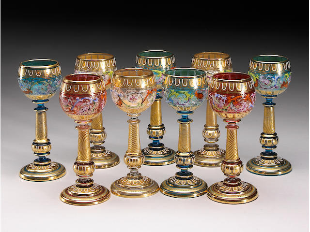 A set of nine Moser gilt and enamel glasses