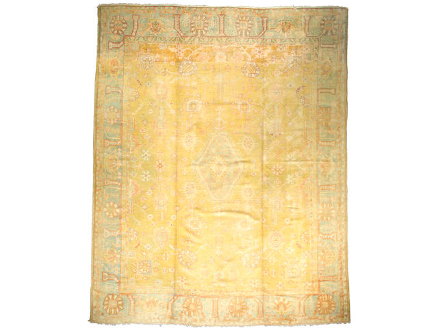 An Oushak carpet West Anatolia size approximately 11ft 6in x 14ft 5in