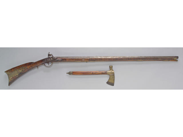 An American full-stocked flintlock buck and ball gun and tomahawk attributed to John Young