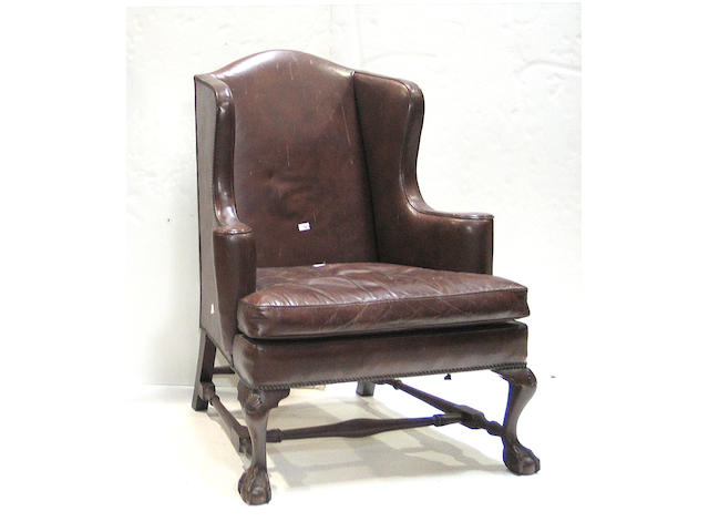 A pair of Chippendale style mahogany wing chairs