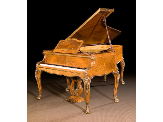 A fine Louis XV style gilt bronze mounted kingwood piano