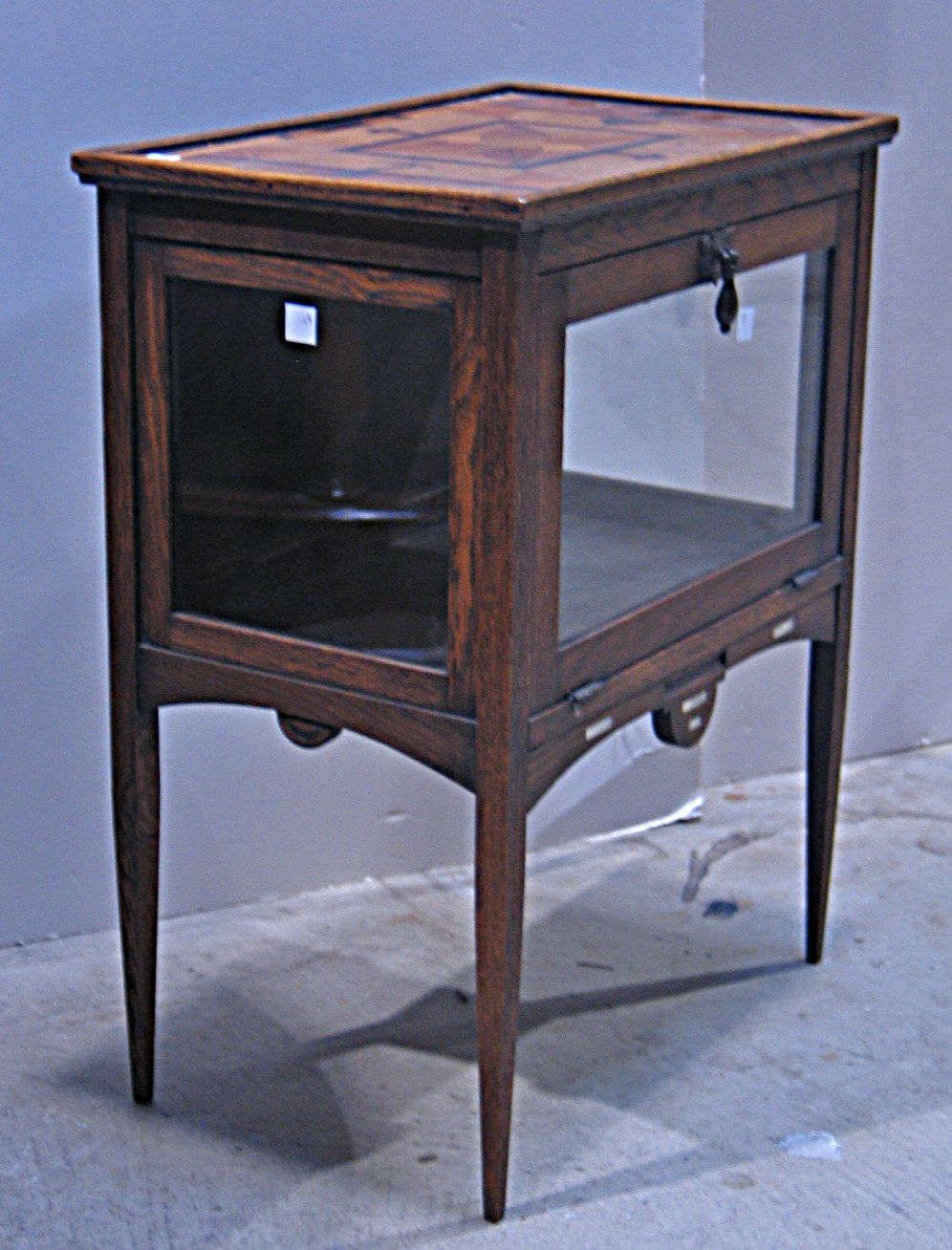 A Victorian stained pine vitrine table