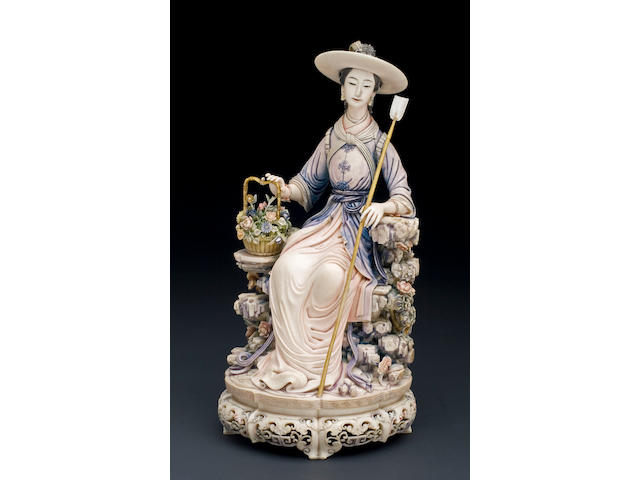 A carved and polychromed ivory figure of a beauty