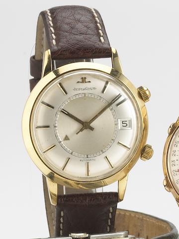 Jaeger LeCoultre. A steel and gold self-winding calendar wristwatch with alarmMemovox, 1960s